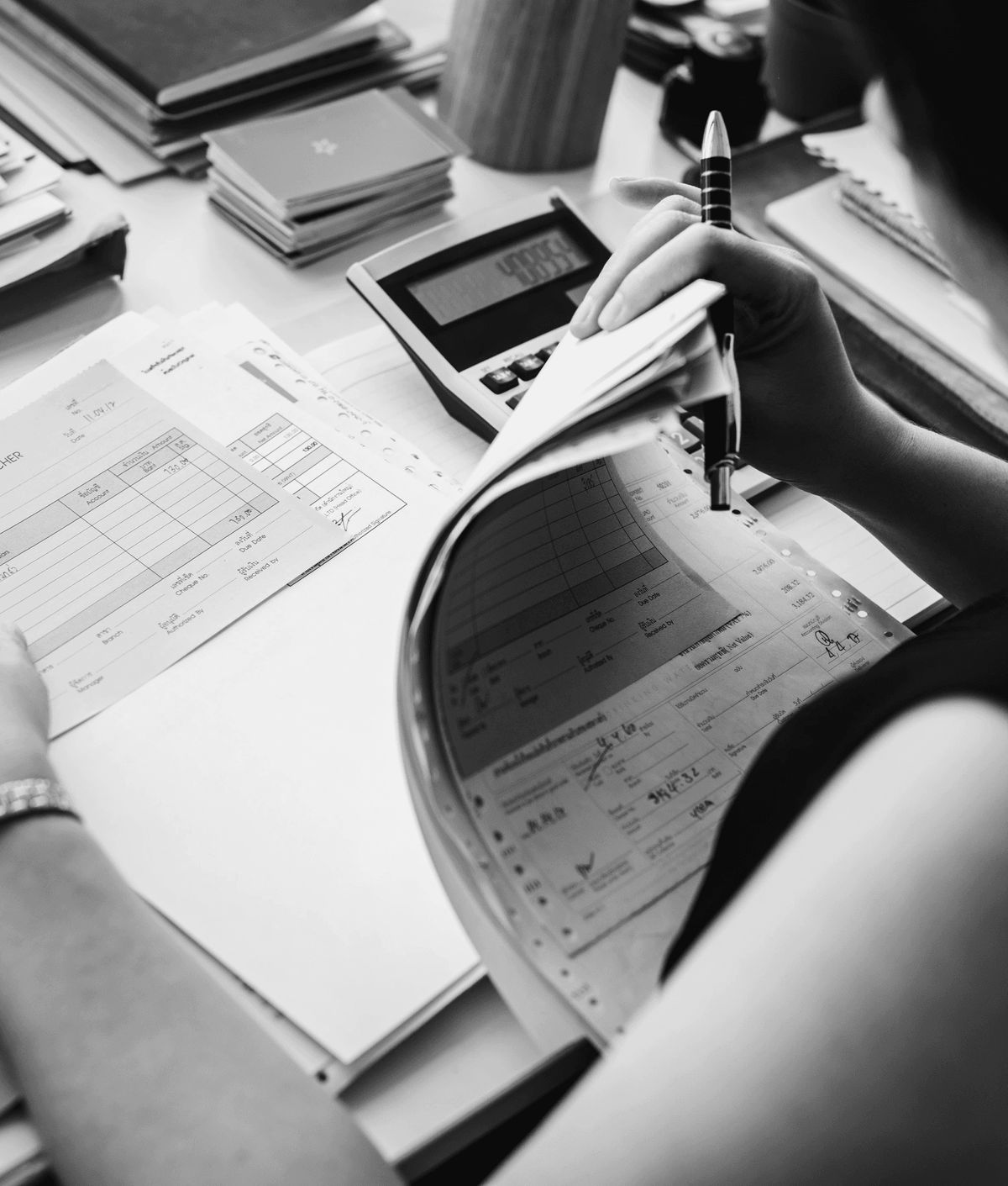 Reviewing financial records at a desk